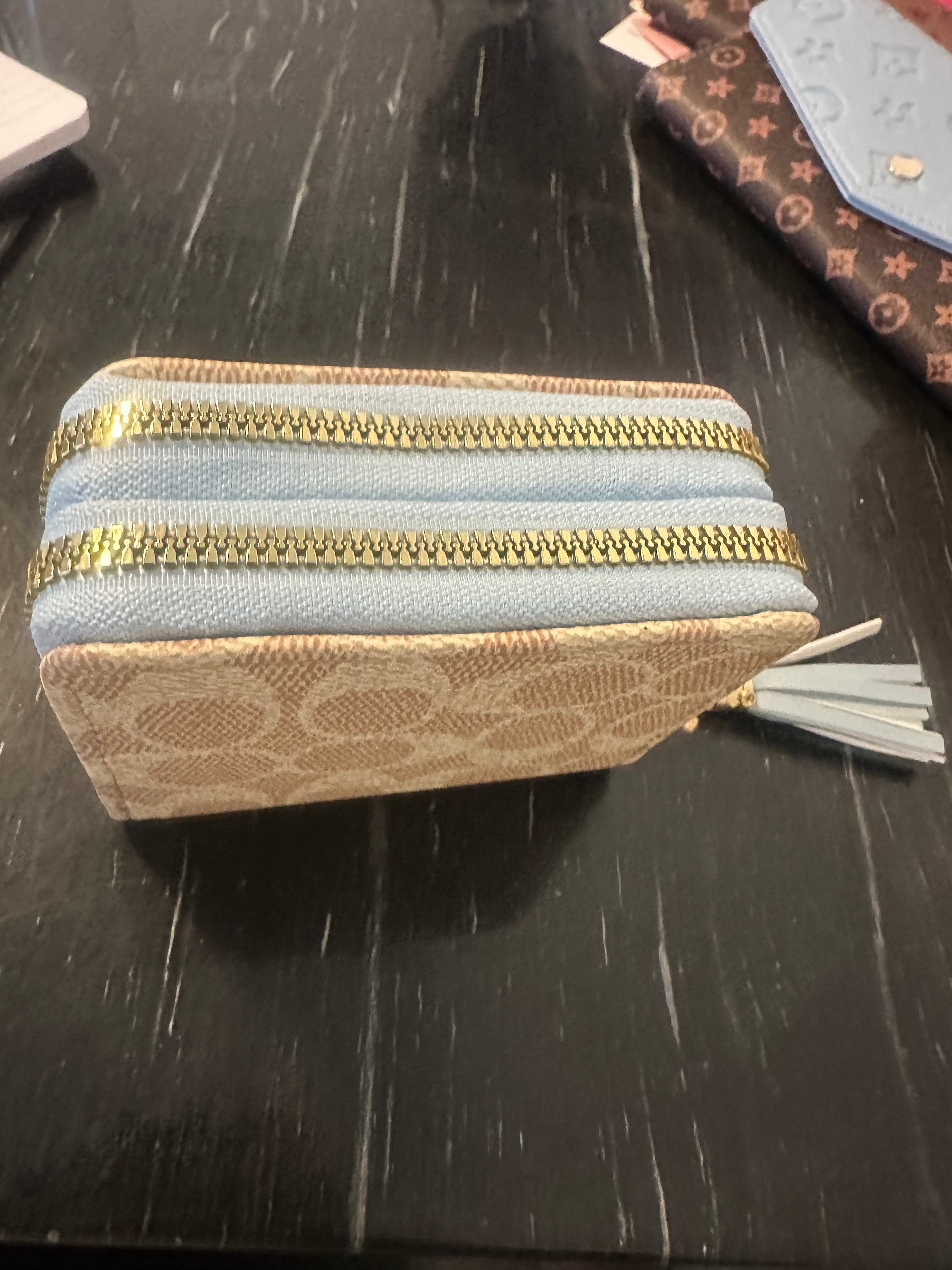 Small tan and blue wallet